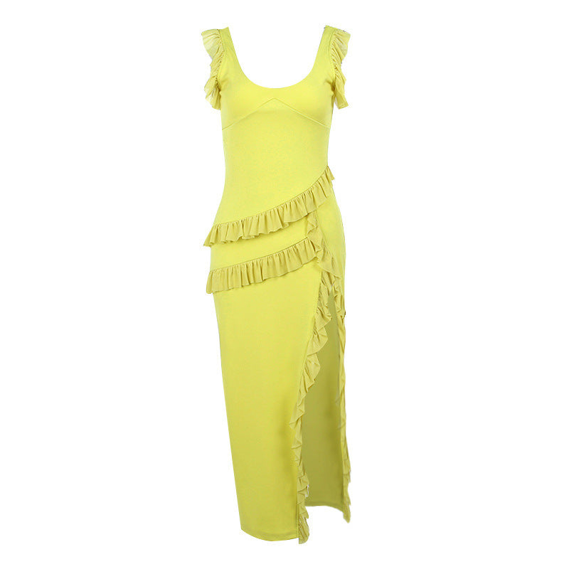 Yellow dress with ruffled details on a white background