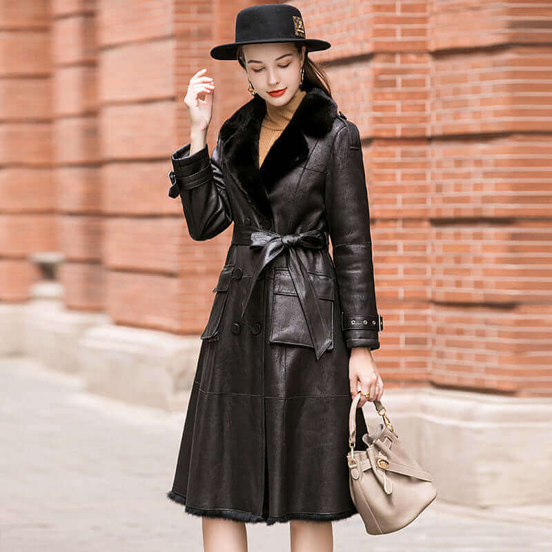 A women standing near a wall wearing Geniune Rabbit Fur Jakcet