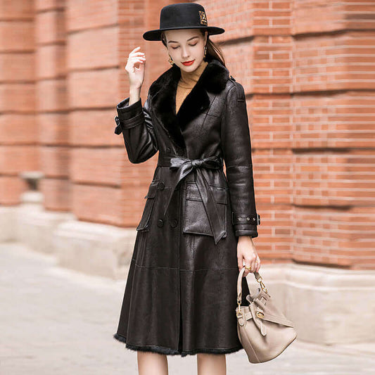 A women standing near a wall wearing Geniune Rabbit Fur Jakcet