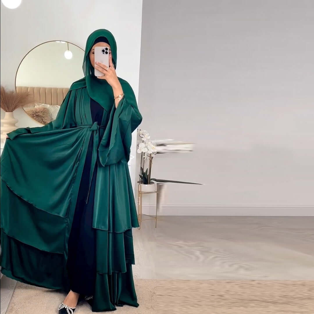 Abayas Online UK main picture. A woman wearing olive green abaya posing front side