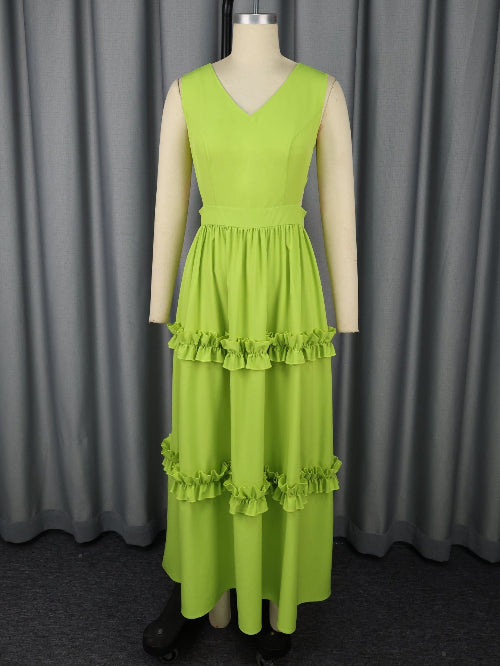 An A-Line High-Waist Mustard Green Dress on a mannequin against a gray curtain background