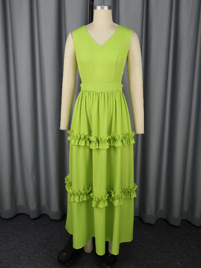 An A-Line High-Waist Mustard Green Dress on a mannequin against a gray curtain background