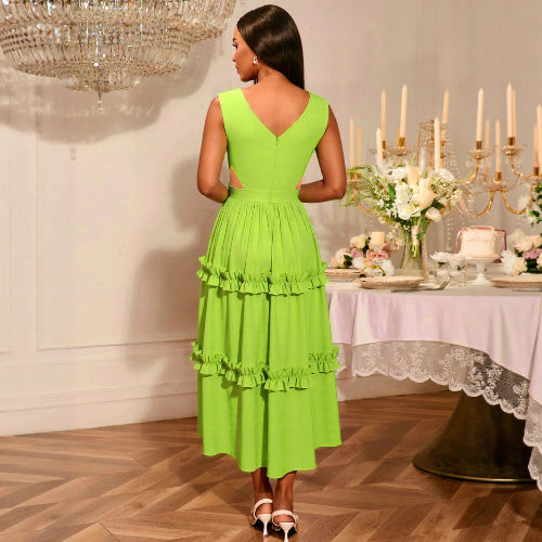 Woman in a A-Line High-Waist Mustard Green Dress standing in a dining room with a table set for a formal dinner.