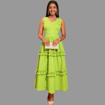Woman wearing a A-Line High-Waist Mustard Green Dress with ruffled layers on a gray background