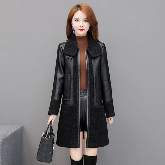 Woman wearing a black leather coat with a gray background