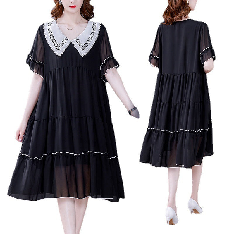 Black dress with white lace details on a white background