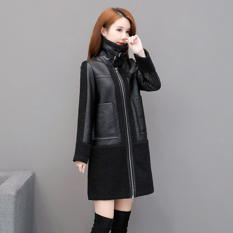 Woman wearing a black coat with a gray background