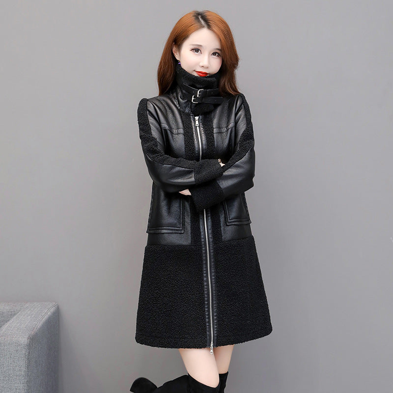 Woman wearing a black leather coat with a gray background
