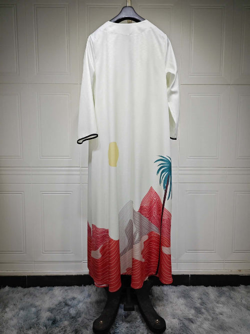 Long white Modest Floral Style Abaya with colorful designs on a hanger against a white paneled wall showing back side of Abaya.